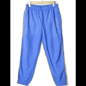 Stussy blue reflective track pants